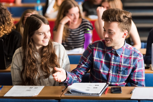 Students discussing topics in a lecture